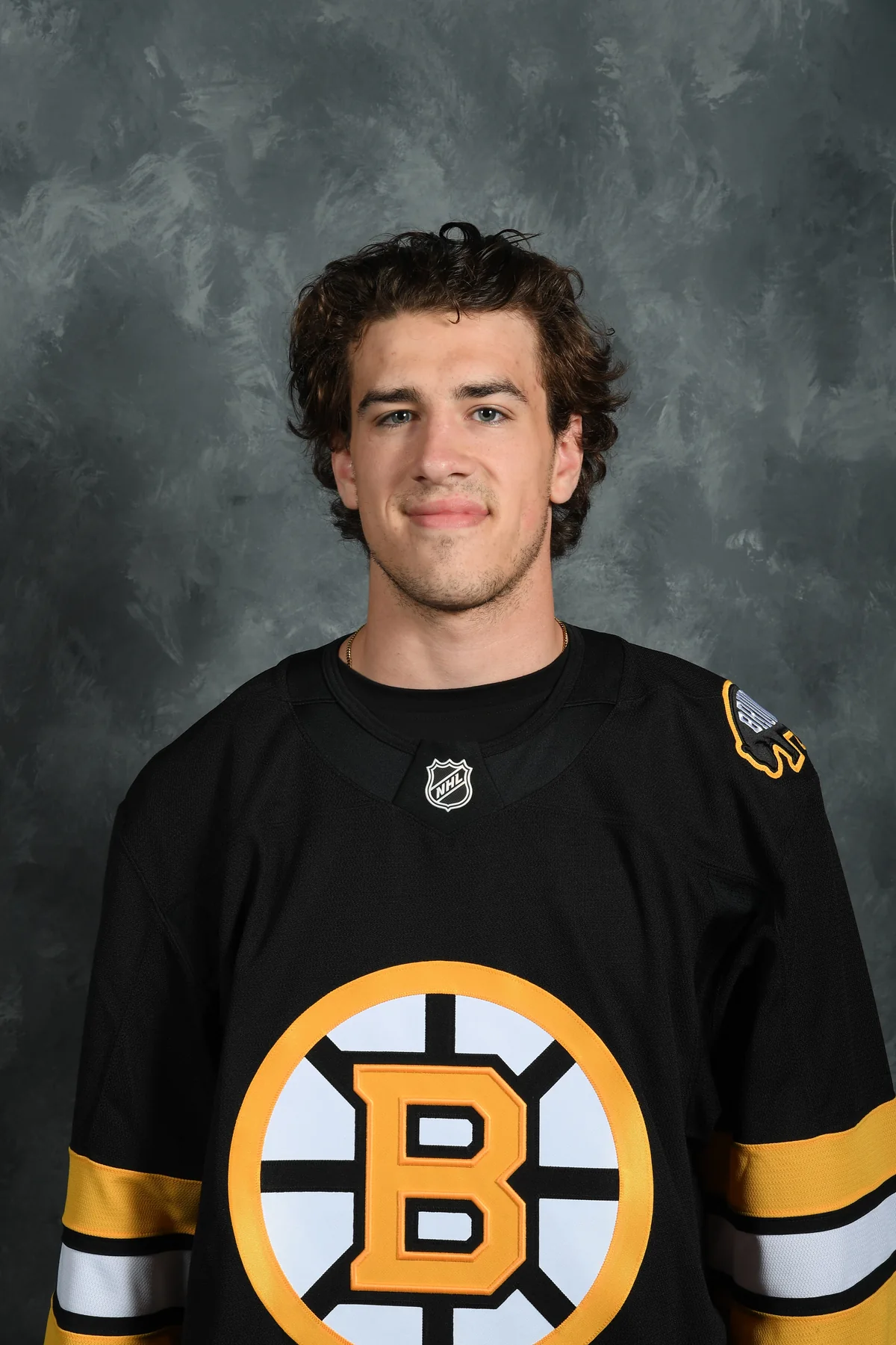 Cullen McCrate in a black Boston Bruins jersey, his official headshot from Bruins development camp in July 2026
